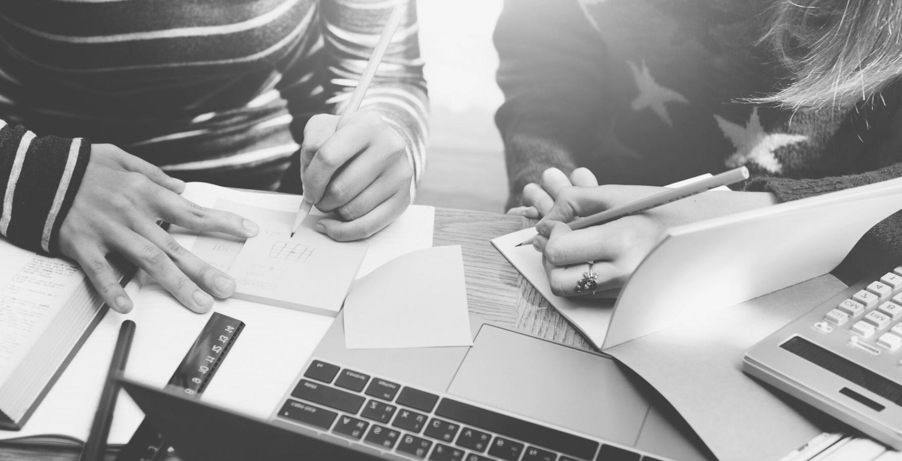 Investment education materials and Canadian financial documents spread on desk