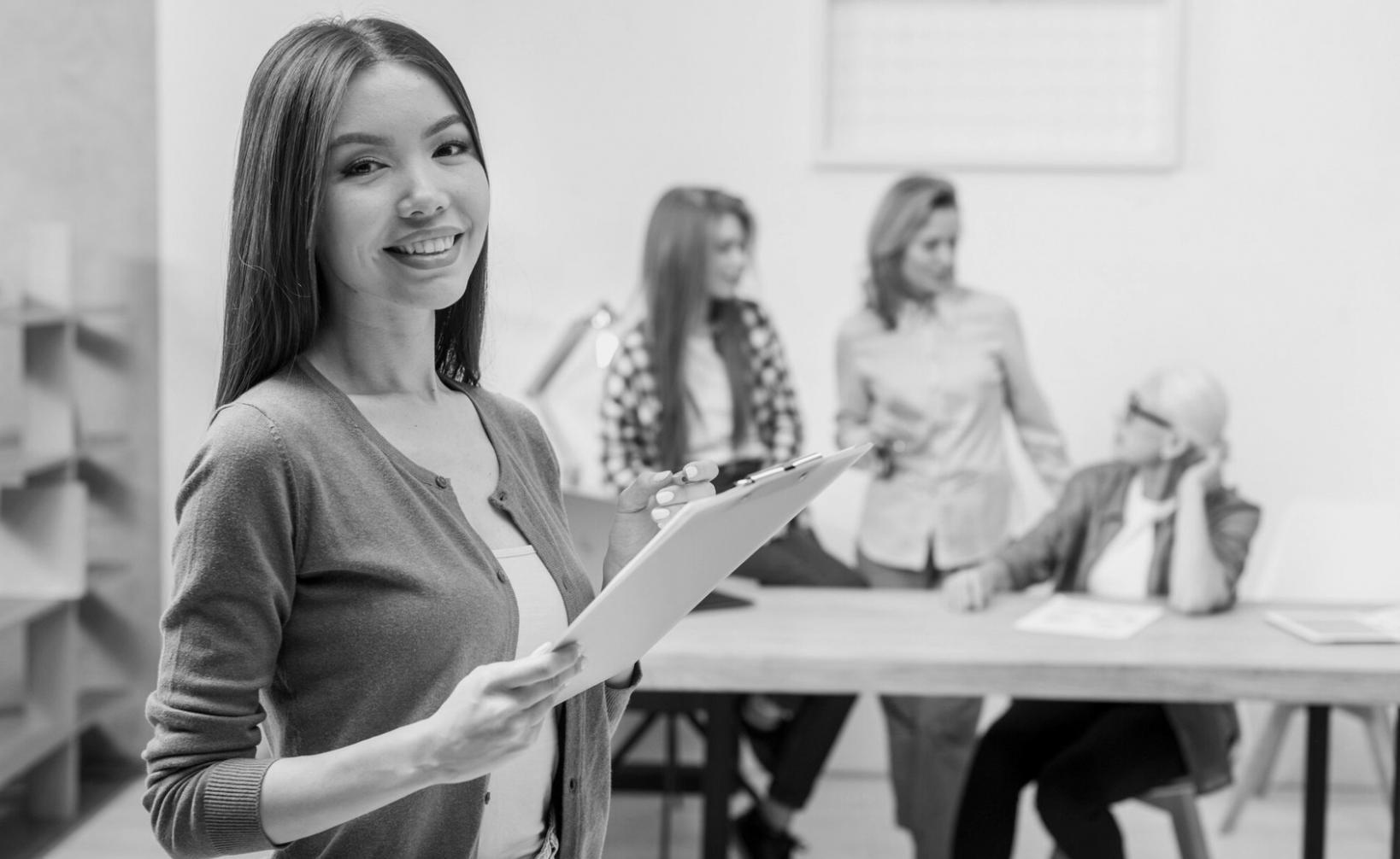 Students learning investment fundamentals in modern classroom setting